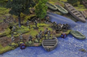 US forces under fire board boats for the river crossing